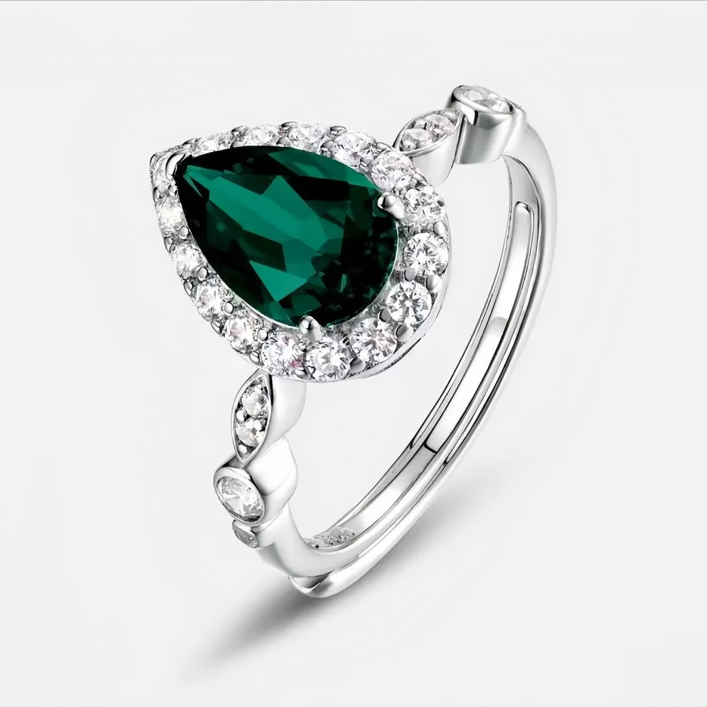 wearing lab grown emerald green pear diamond halo ring S925 sterling silver on hand model