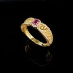 top view flat lay lab grown ruby bow filigree ring on beige background S925 silver