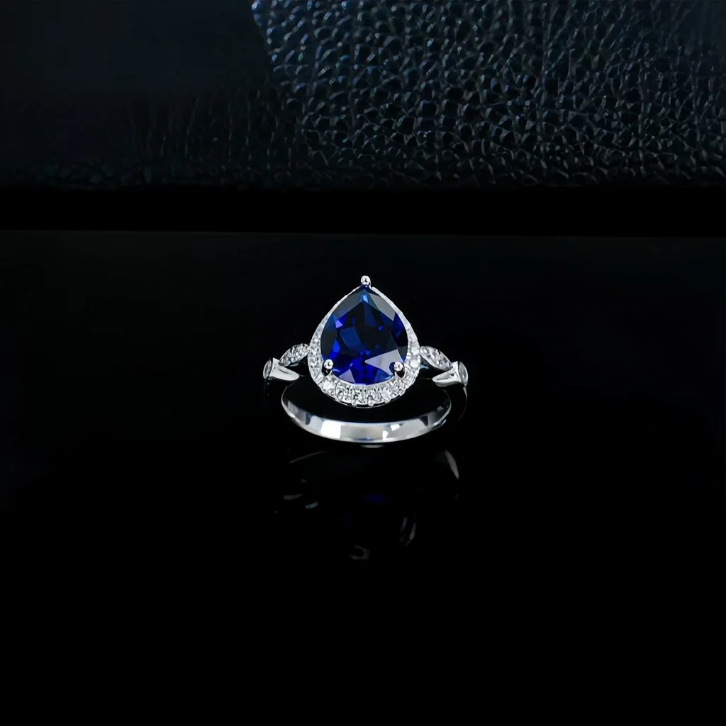 close up detail of lab grown heart shaped blue diamond ring 8x10mm S925 sterling silver prong setting