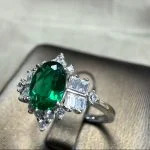 lab grown vintage crown emerald ring S925 sterling silver worn on hand finger oval cut green gemstone baguette diamond accents adjustable band
