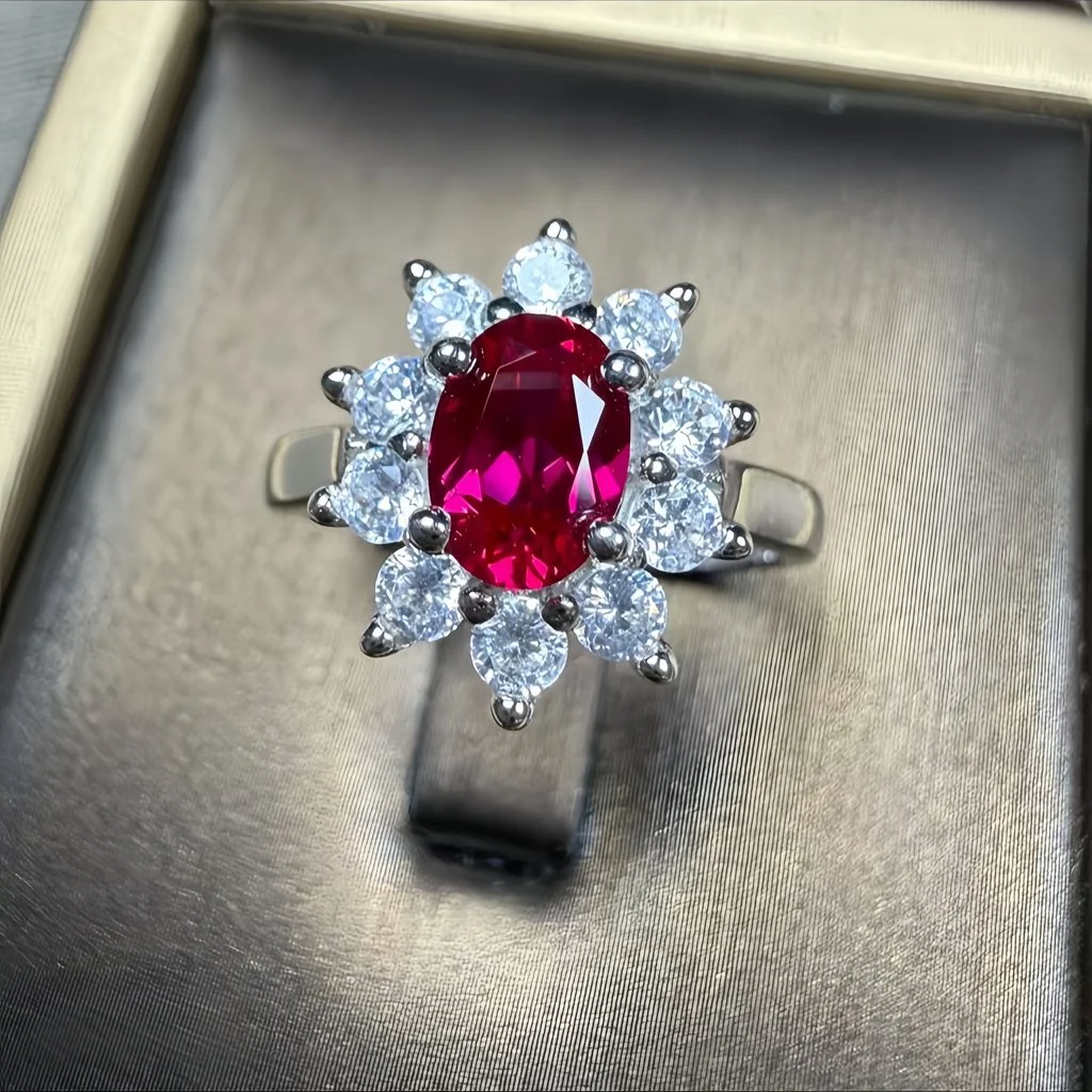 lab grown pigeon blood ruby Diana halo ring S925 sterling silver angle view on display oval cut red gemstone round diamond cluster halo dimensional setting