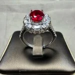 lab grown sunflower halo ruby ring S925 sterling silver side profile view pear shaped diamond accents oval cut red gemstone adjustable band