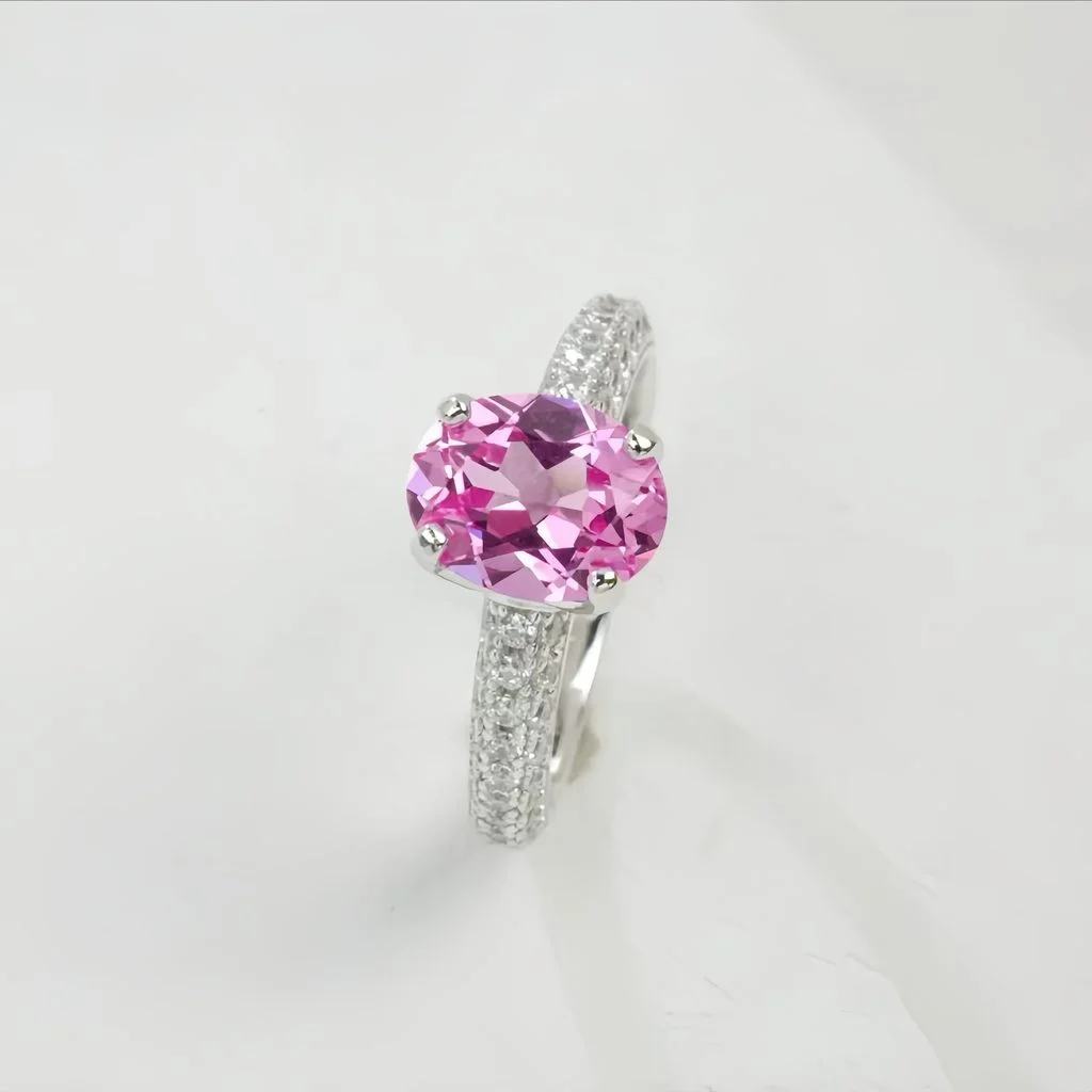 lab grown padparadscha sapphire oval ring S925 sterling silver side profile view pavé halo band prong setting closed band design