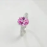 lab grown padparadscha sapphire oval ring S925 sterling silver top-down flat lay view pavé halo closed band lotus pink orange gemstone