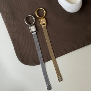 Vintage women's square watch with oversized ring detail and magnetic Milanese mesh strap, shown in gold and silver tones