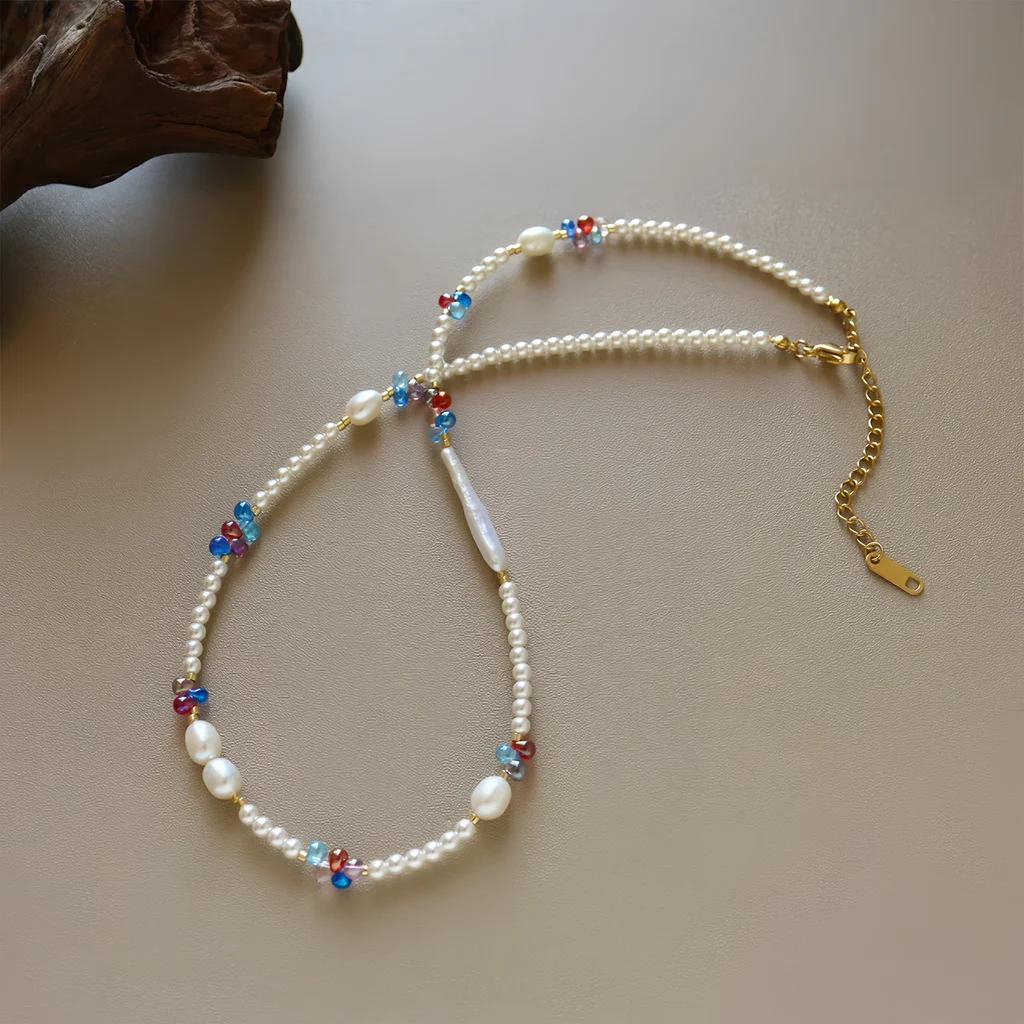 Dopamine freshwater pearl and crystal beaded necklace product specification card with PAR Product Information header, showing material brass baroque pearl Swarovski pearl, weight 8.91g, and size 42 plus 6cm extension chain details by MAISON ELARA & CO