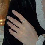 Woman wearing dainty freshwater pearl ring, 925 sterling silver everyday jewelry lifestyle shot