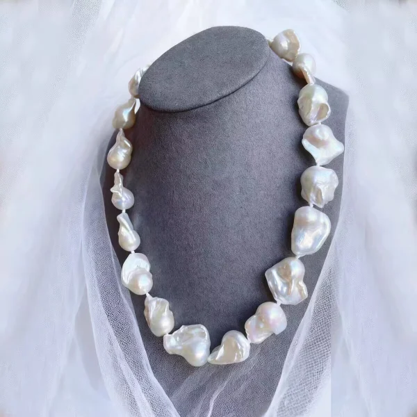 Large baroque pearl necklace on gray jewelry bust, natural freshwater irregular statement pearls