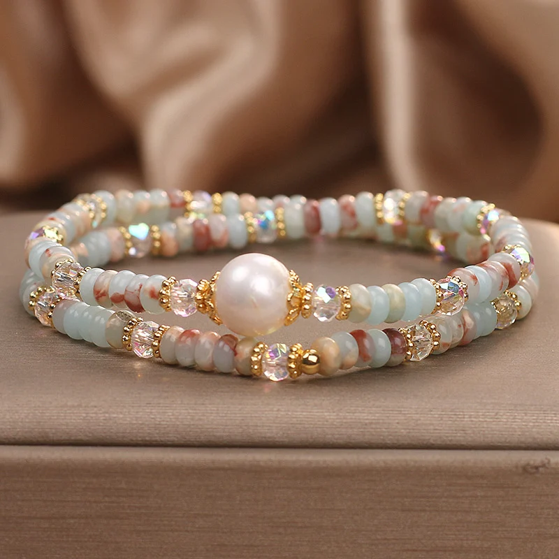 Natural Shoushan stone pearl double-layer bracelet with freshwater pearl focal stone and faceted AB crystal accents, Chinese style beaded stacking bracelet in sky blue milky white and reddish-pink tones on beige satin background