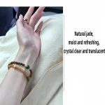 Woman wearing caramel gradient Hetian jade beaded bracelet on wrist, natural jade stone everyday jewelry lifestyle shot