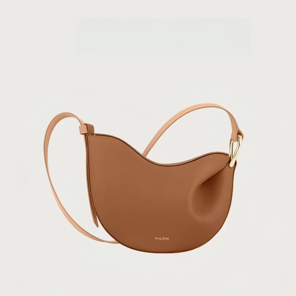 Alt Text: Women's pea shaped litchi grain cowhide hobo crossbody bag available in 5 colors: white, dark brown, black and taupe