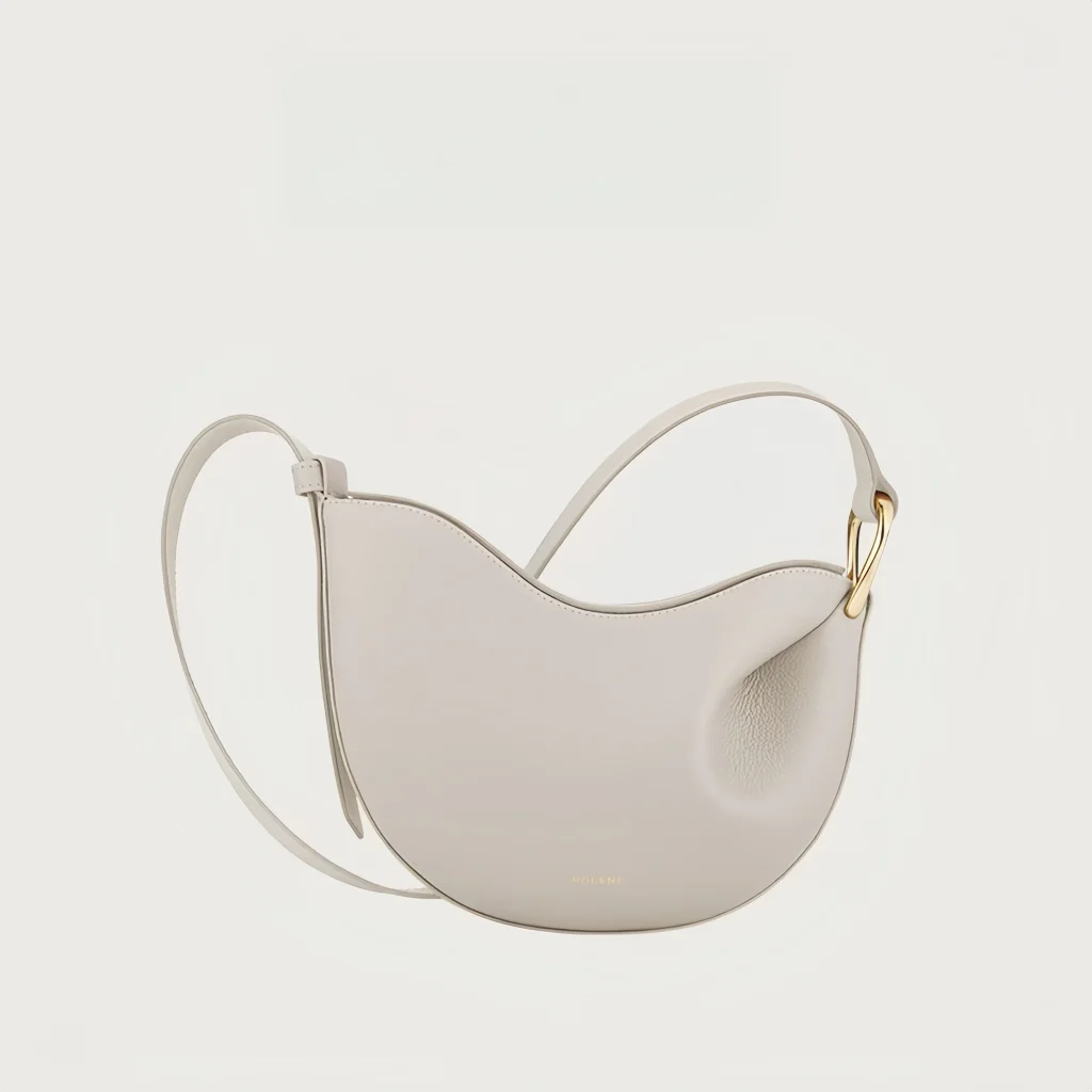 Alt Text: Women's pea shaped litchi grain cowhide hobo crossbody bag available in 5 colors: white, dark brown, black and taupe