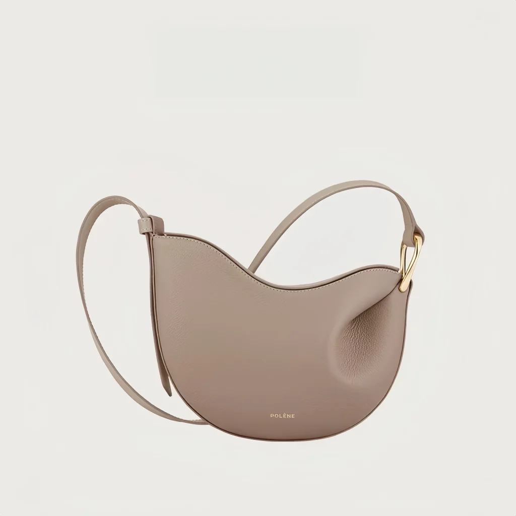 Alt Text: Women's pea shaped litchi grain cowhide hobo crossbody bag available in 5 colors: white, dark brown, black and taupe