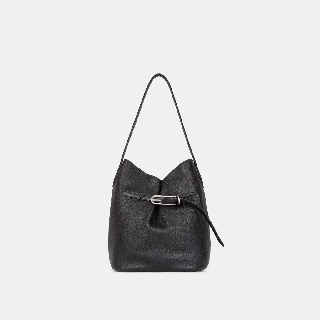 Bottom view of Lock-Top Bucket Bag, showing leather base and protective leather feet