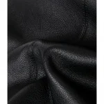 Close‑up texture shot of soft genuine top‑grain cowhide leather for oversized bucket hobo bag