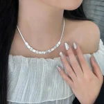 Model wearing S925 sterling silver broken‑silver cube choker necklace