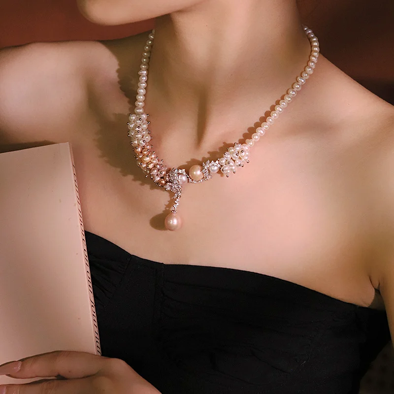 Close-up shot of handcrafted natural freshwater pearl snake flower vine zircon necklace with drop pearl pendant