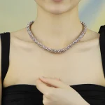 Model wearing multi‑strand twisted natural purple freshwater pearl magnetic clasp choker necklace, minimalist high‑end collarbone jewelry for women