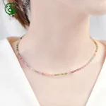 Woman wearing natural rainbow tourmaline cube choker, dainty crystal collarbone necklace