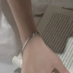 S999 sterling silver shell geometric bracelet on female wrist, minimalist French vintage women jewelry