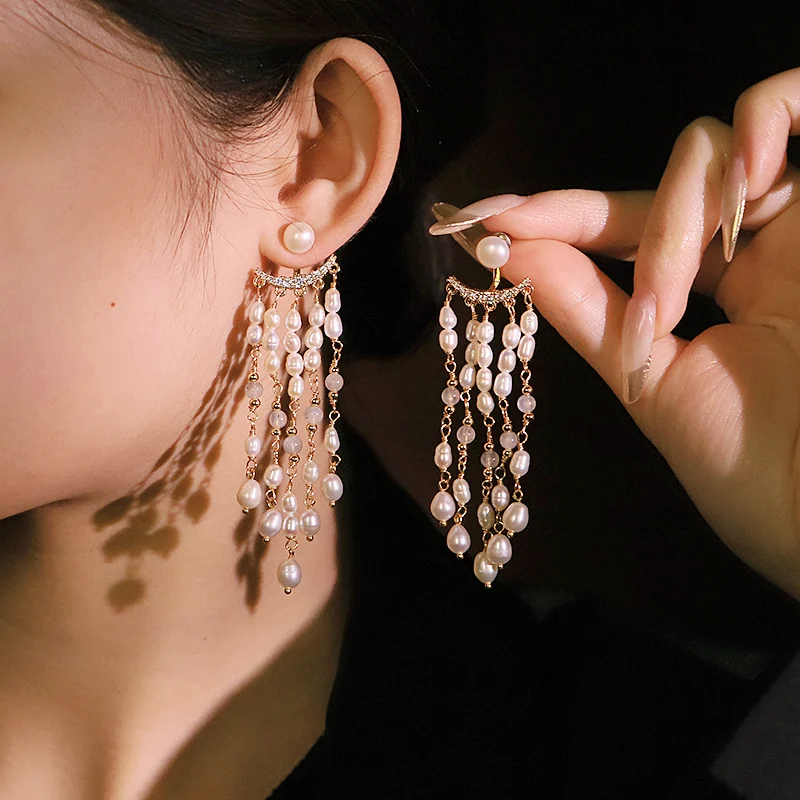 Woman wearing natural pearl zircon long tassel dangle earrings, elegant formal ear jewelry wear‑show