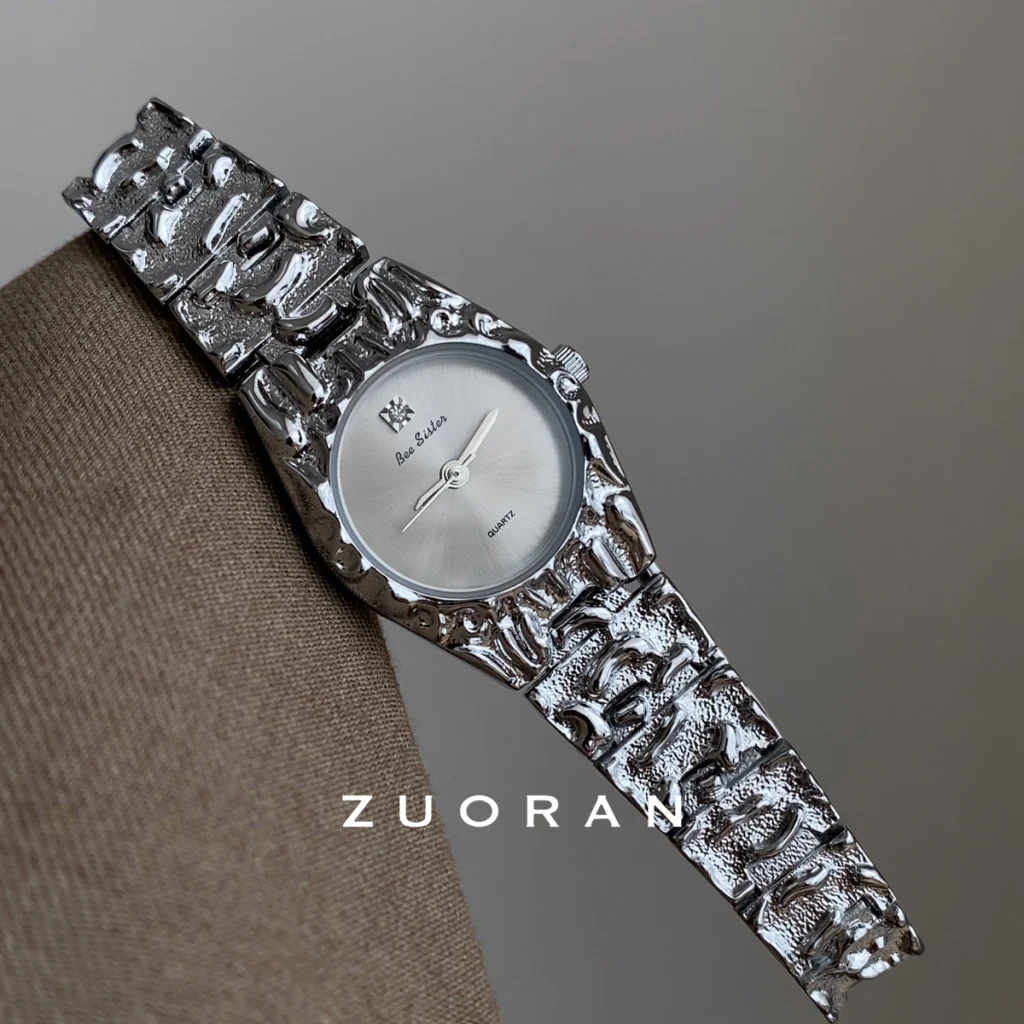 Side view of Bee Sister silver textured quartz watch, artistic crumpled metal band design