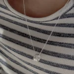 S925 sterling silver multi stacked ring pendant necklace worn on collarbone with striped knit sweater, minimalist silver necklace for women