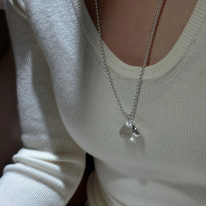 S925 sterling silver bead chain teardrop crystal necklace worn on collarbone with cream ribbed sweater