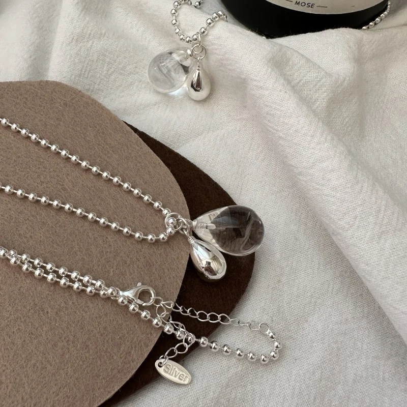 Full view of S925 silver ball chain necklace, showing extension lobster clasp and silver brand tag