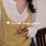 S925 sterling silver bean pendant necklace worn with yellow knit camisole and white inner top, daily Korean outfit
