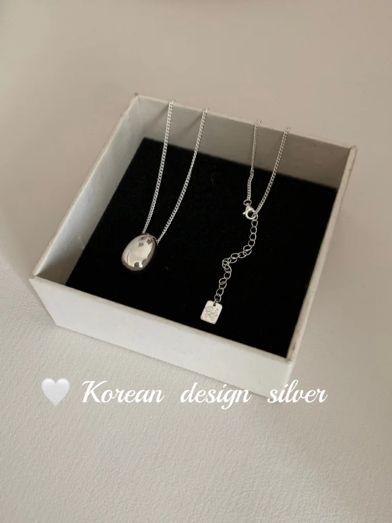 S925 sterling silver oval bean pendant necklace displayed in white jewelry gift box