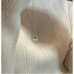 S925 sterling silver hollow circle necklace close-up on cream ribbed sweater, women everyday styling