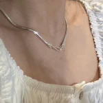 S925 flat snake chain necklace worn on neck with white square neck blouse, minimalist styling