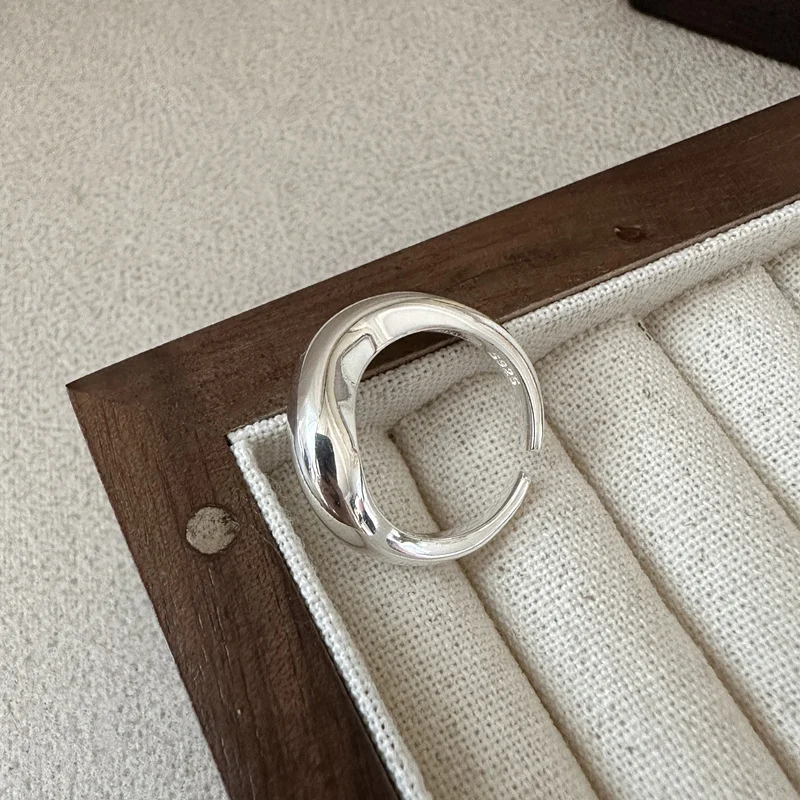 Polished S925 sterling silver irregular open ring, chunky curved cuff ring in wooden jewelry tray