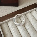 Matte brushed irregular curved sterling silver open ring, minimalist chunky cuff ring display