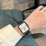 LEONA ROSA LIND women square moonphase watch, elegant silver case with white dial, worn with white blouse and jeans for casual office style