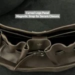Top‑down interior view of navy genuine leather hobo tote bag, showing inner compartments and magnetic snap closure