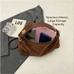 Interior view of frosted deer suede hobo bag showing spacious main compartment capacity with smartphone glasses and daily essentials demonstrating large storage space