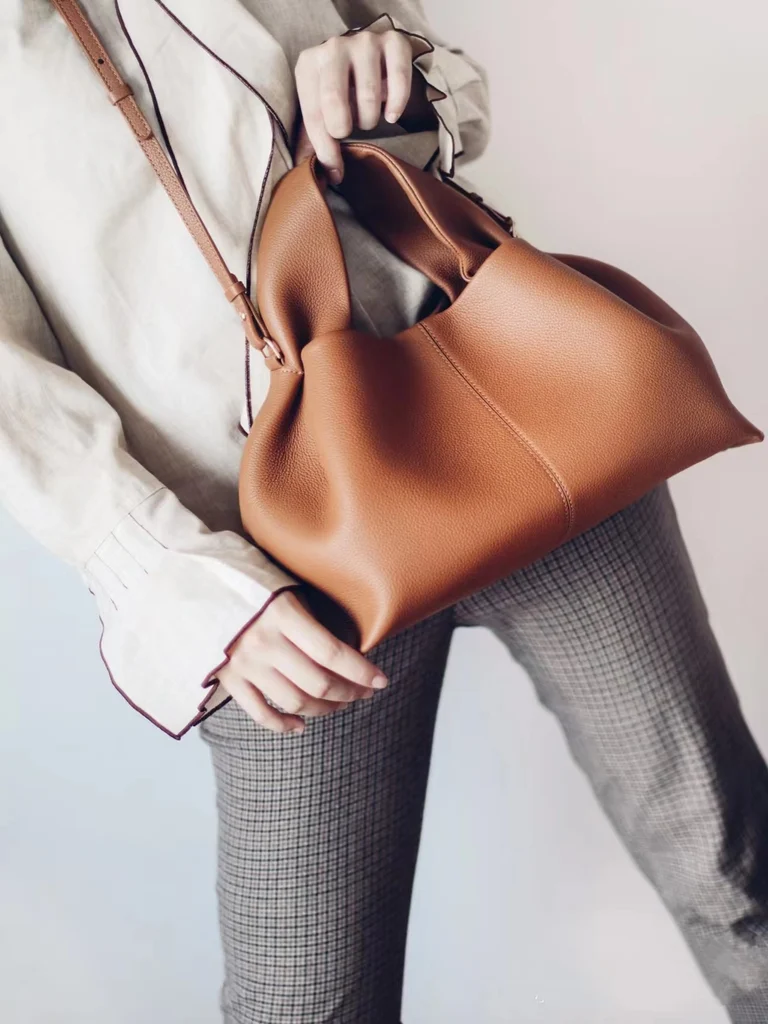 Caramel suede cloud bag with trench coat, autumn fashion vintage dumpling handbag styling