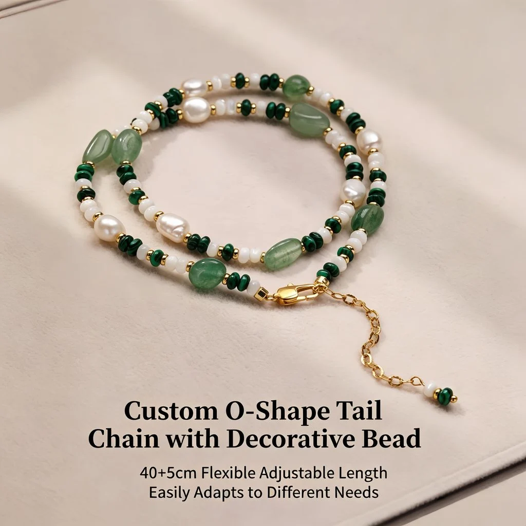 Model wearing natural freshwater pearl and crystal beaded necklace in close-up portrait, showing collarbone placement of baroque pearls, malachite chips, aventurine ovals, and 18K gold-plated accent beads by MAISON ELARA & CO