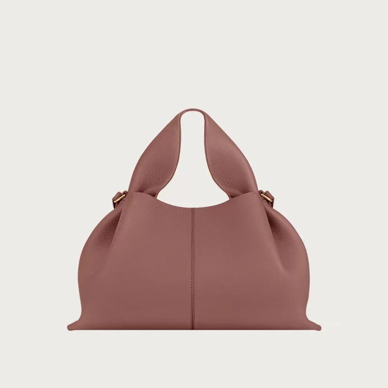 Vintage suede cloud dumpling bag worn crossbody style, retro shoulder handbag everyday wear