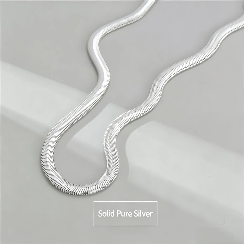 Close-up of flexible S925 sterling silver flat snake chain texture, ribbed silver collar necklace detail