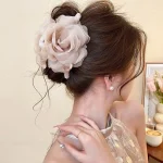 Elegant pearl camellia hair claw side view